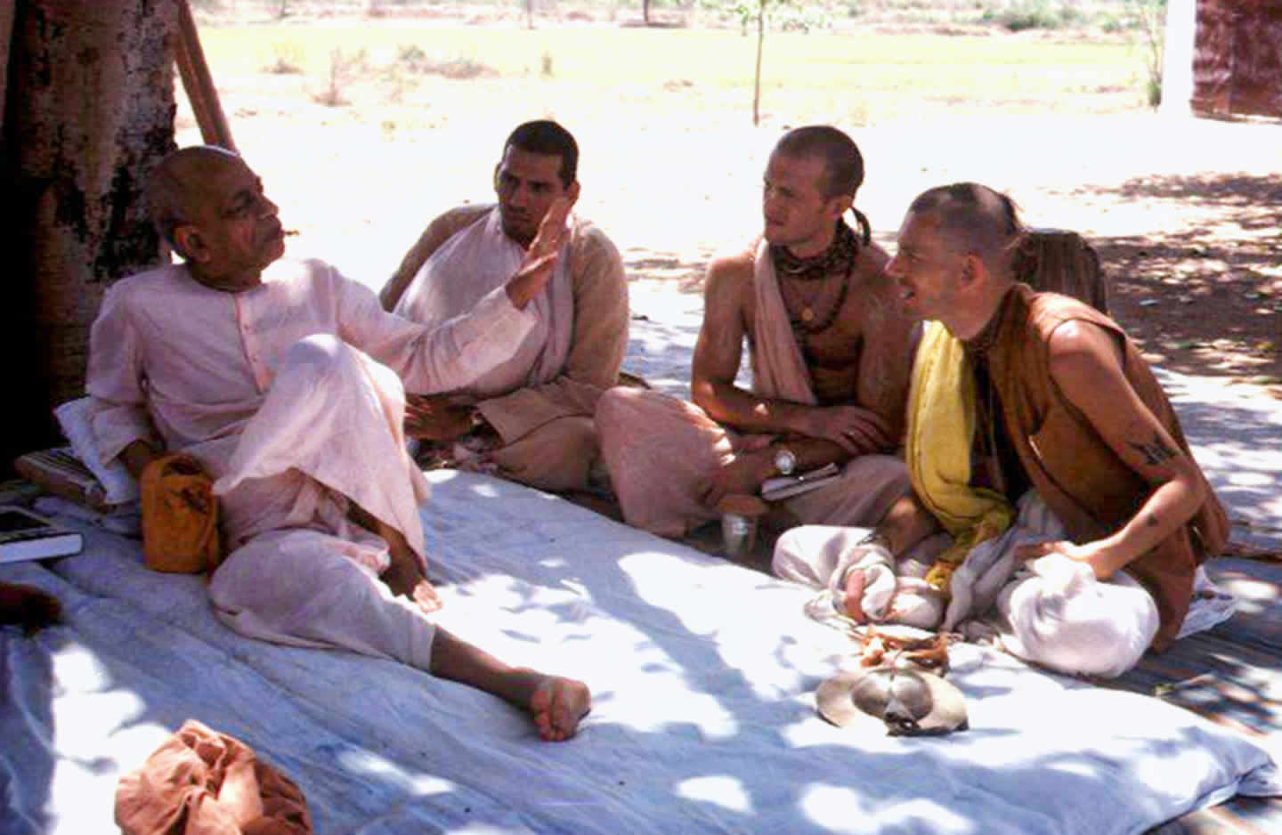 Prabhupada teaching under a tree.